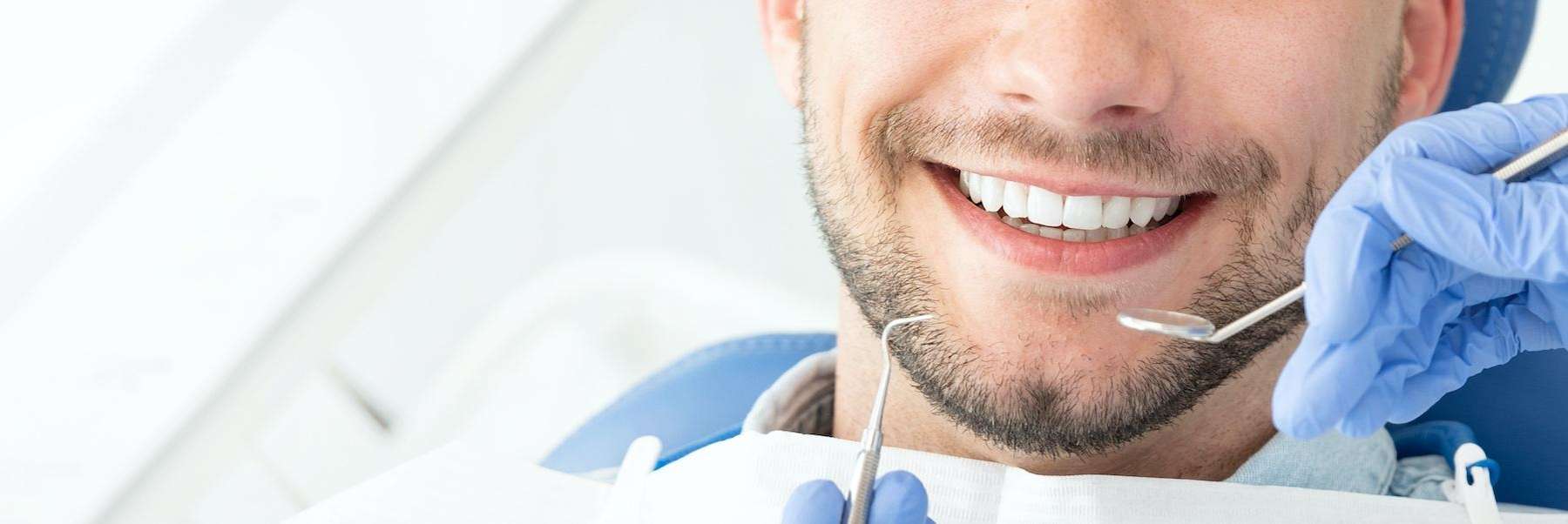 man smiling during dental visit